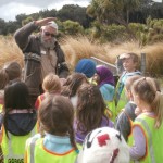 Mark-Oster,-Environment Southland -Education-Officer,-tells-Gorge-Road-School-juniors-about-what-lives-in-wetlands.